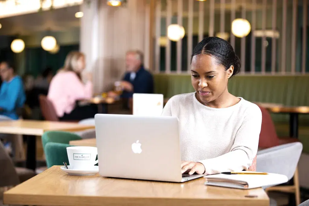 A woman working at a laptop