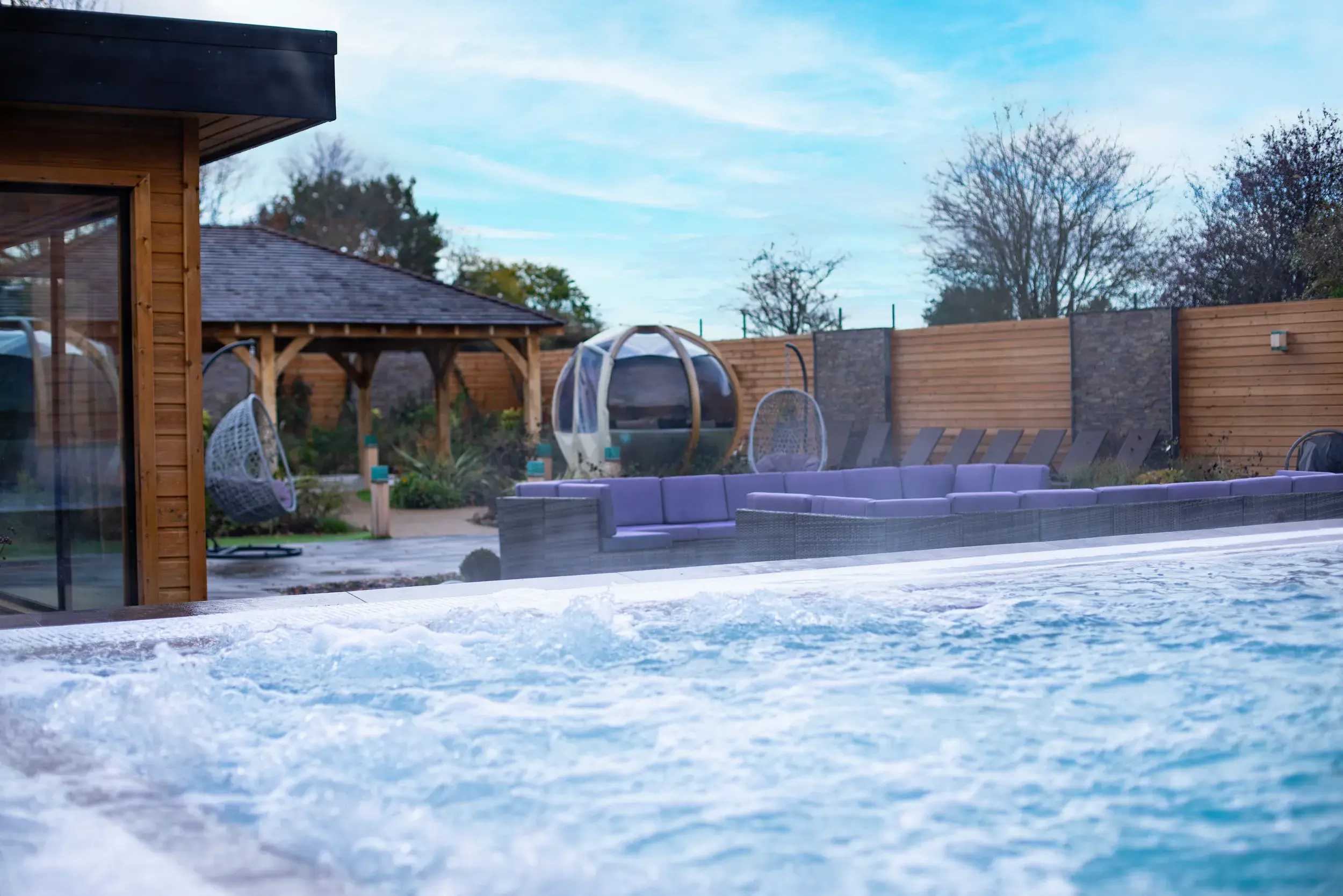 Comfy chairs and cocooning pods in our Spa Garden