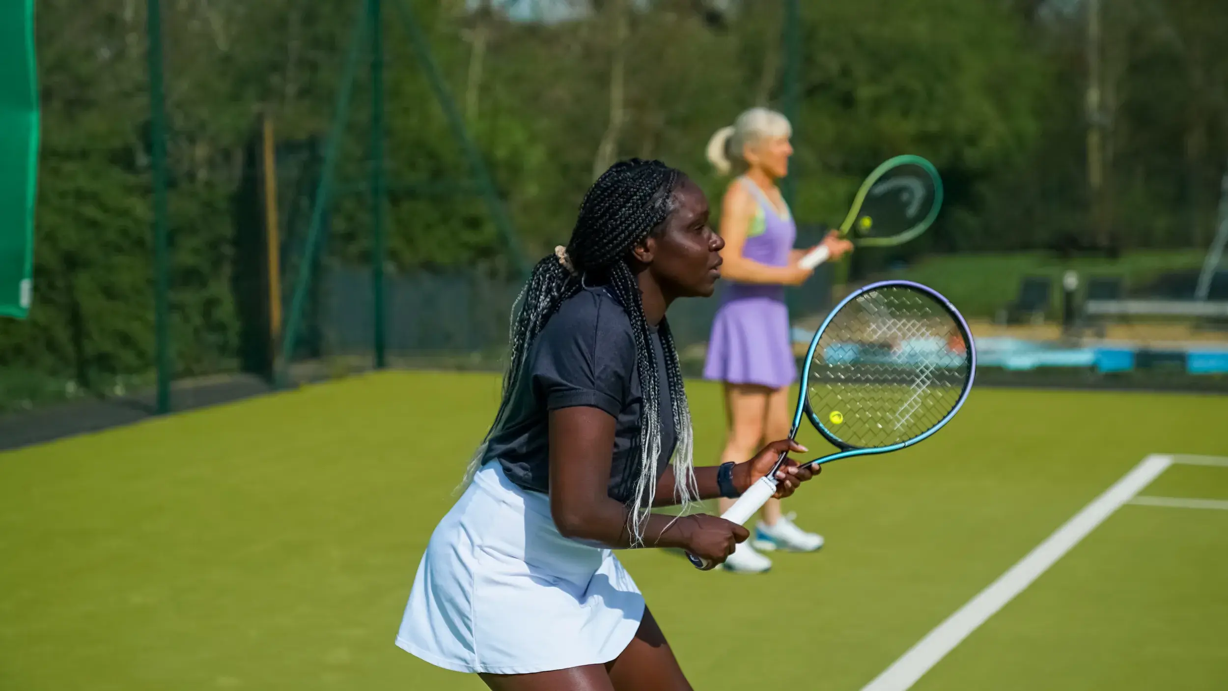 Two women playing tennis