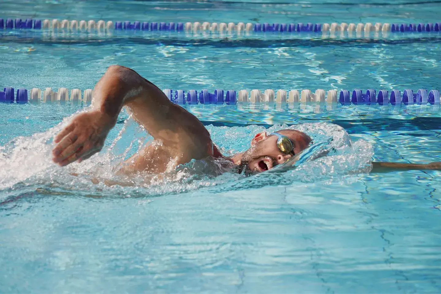 A man swimming front crawl