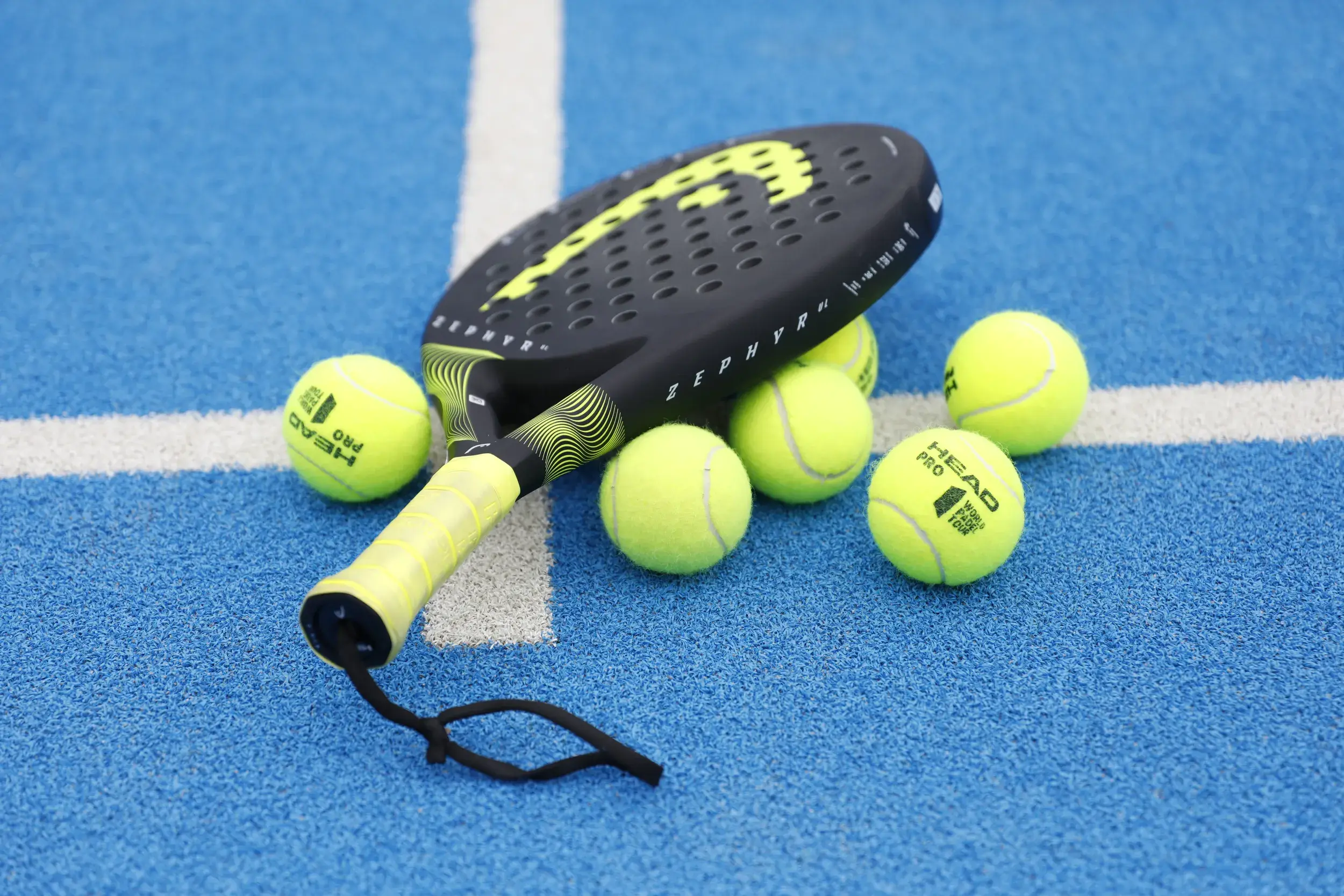 A Padel racquet and ball