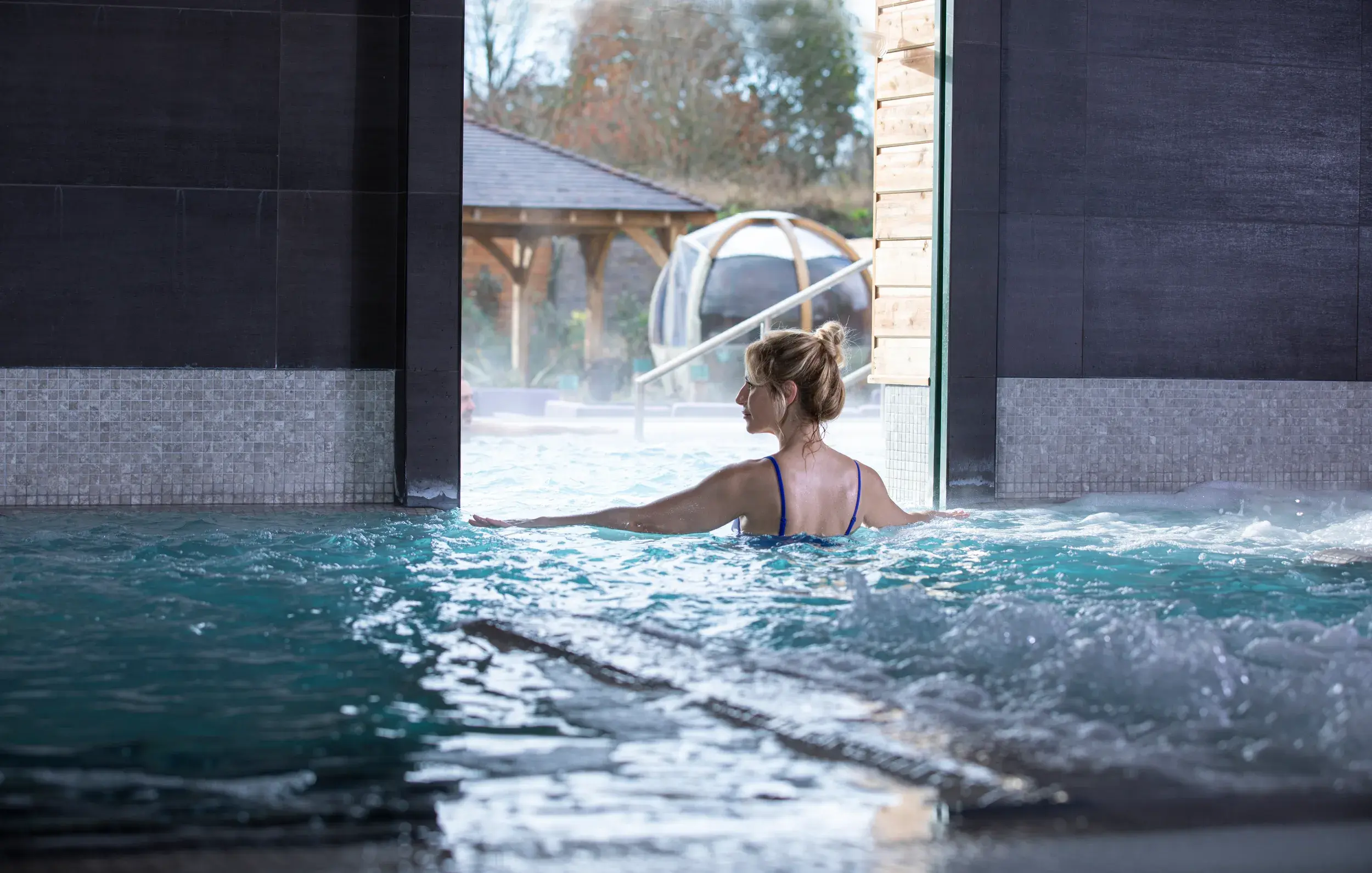 A woman in the whirlpool at David Lloyd Raynes Park