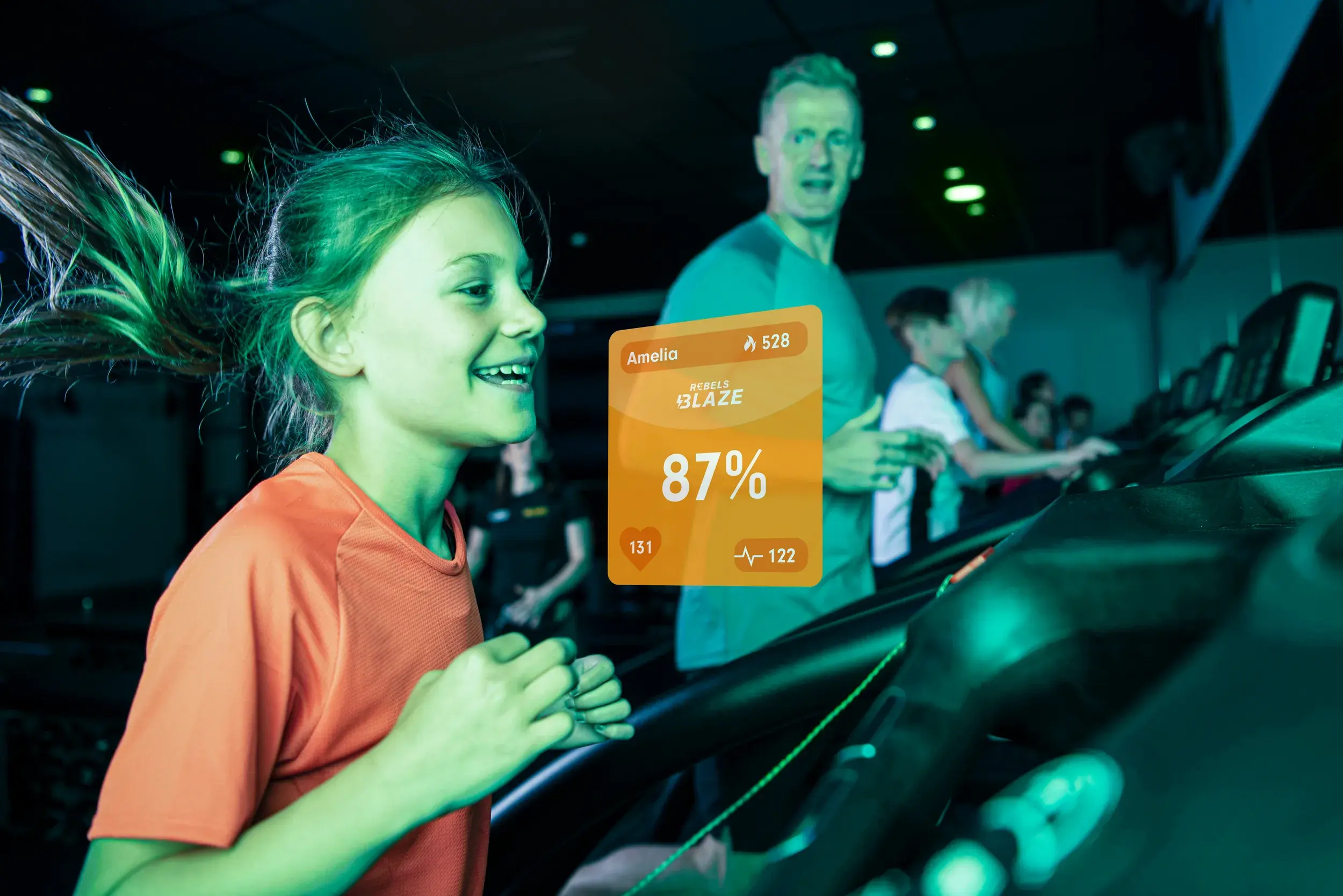 A young girl running on a treadmill in a Blaze Rebels class
