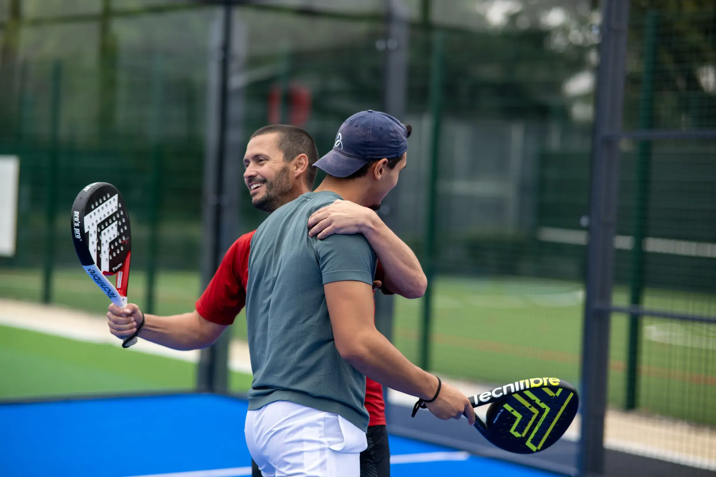 Two people playing a Padel match