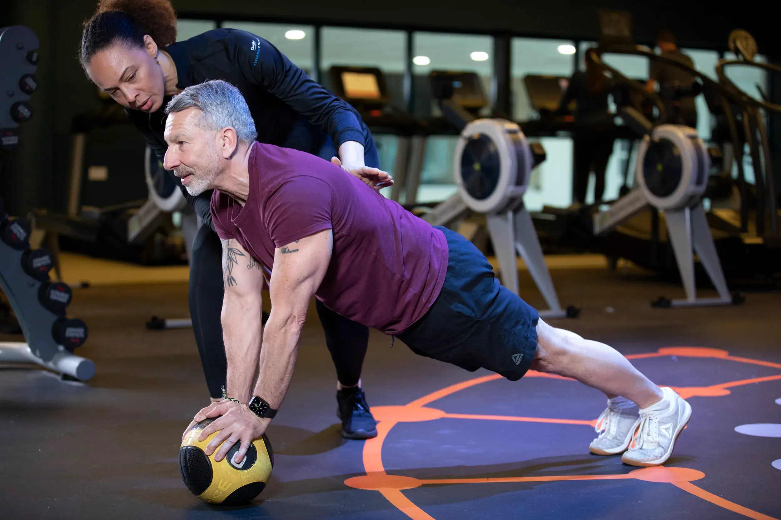A personal trainer works with their client at David Lloyd Colliers Wood