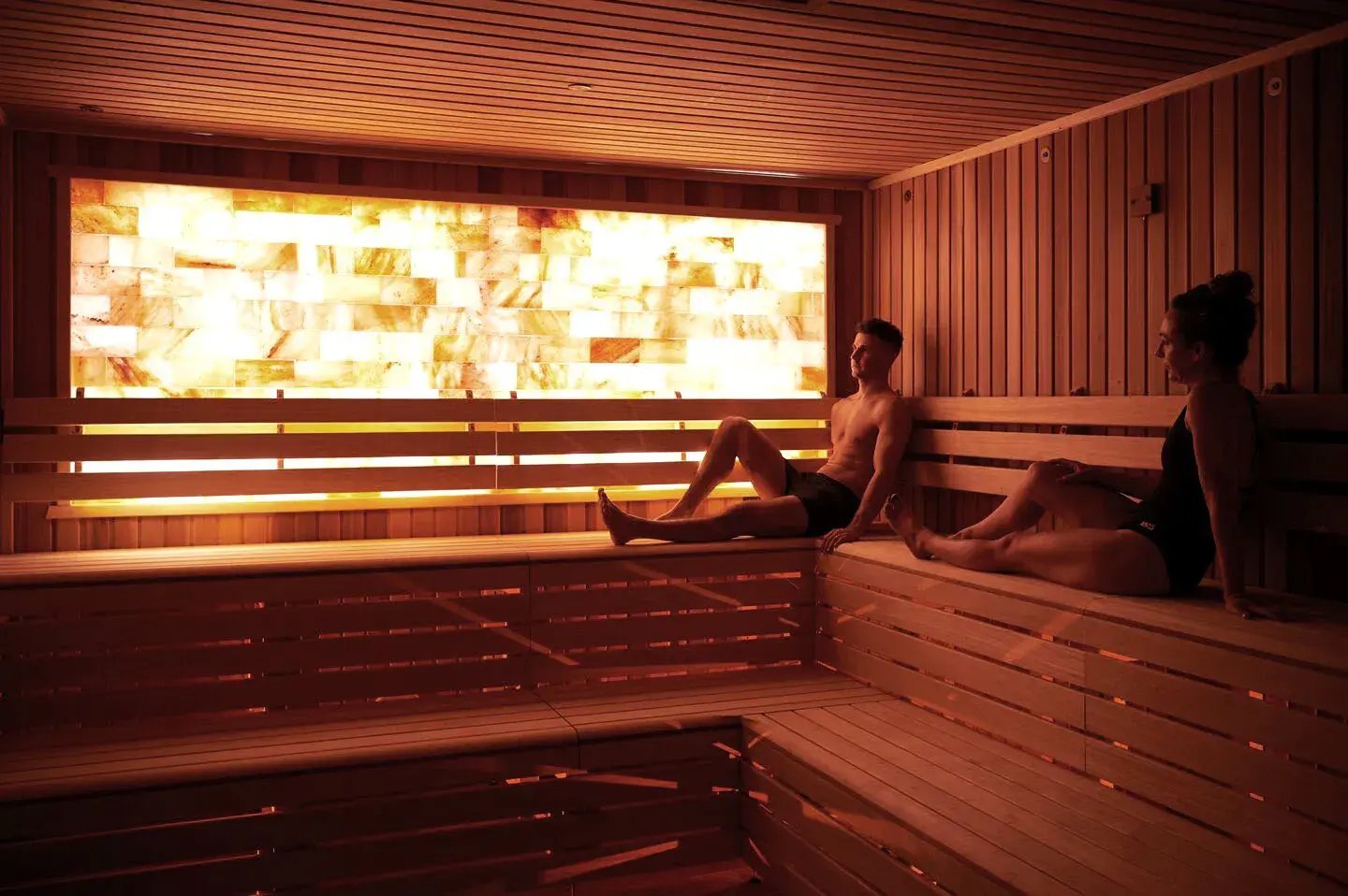 Two people enjoying the sauna