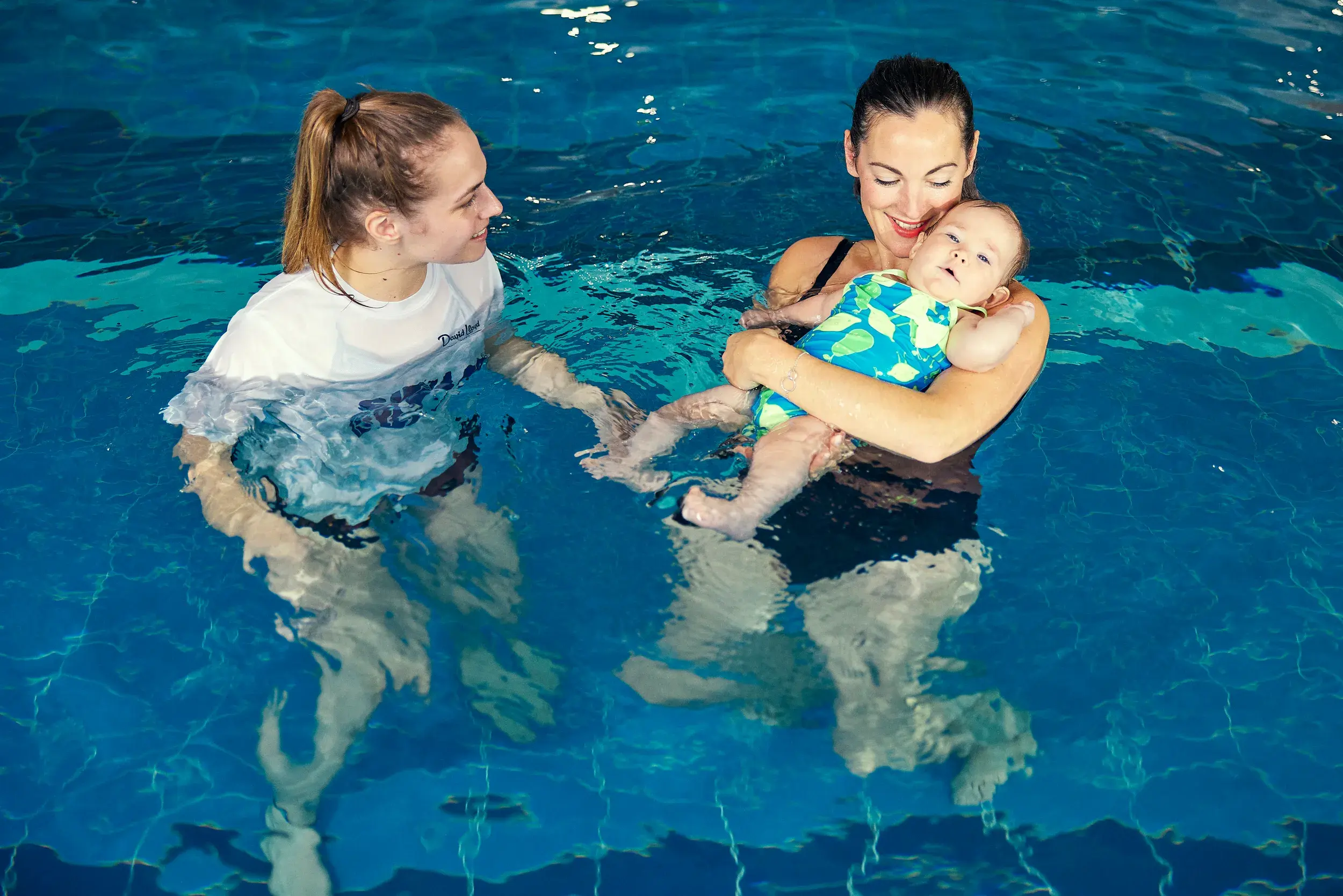 A young child being taught to swim by a David Lloyd swim instructor