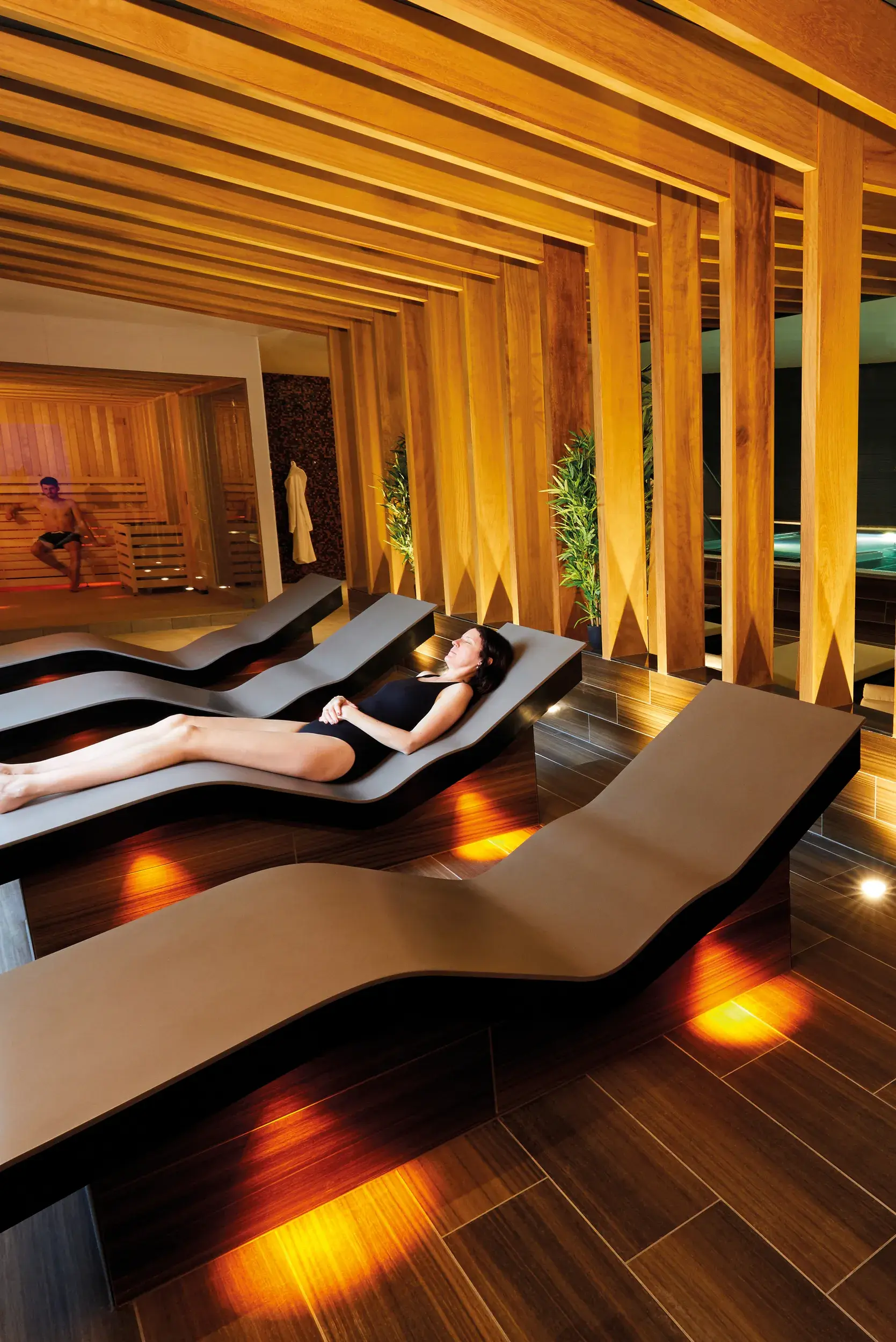A woman lying on heated beds