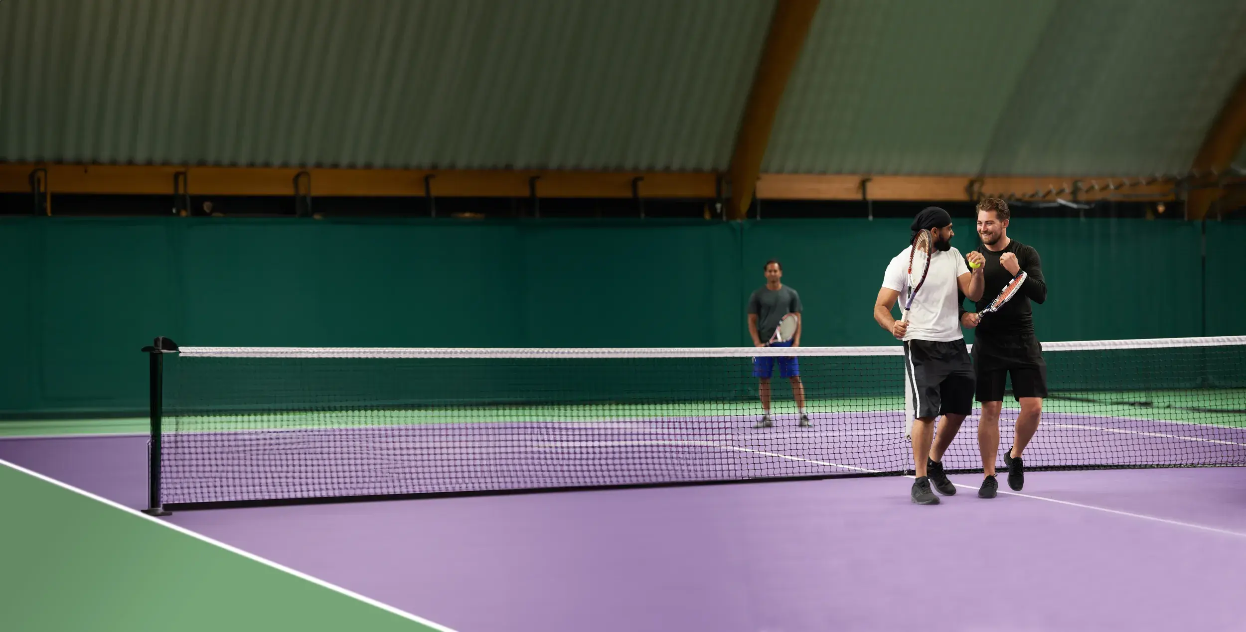 Two men on the indoor tennis courts