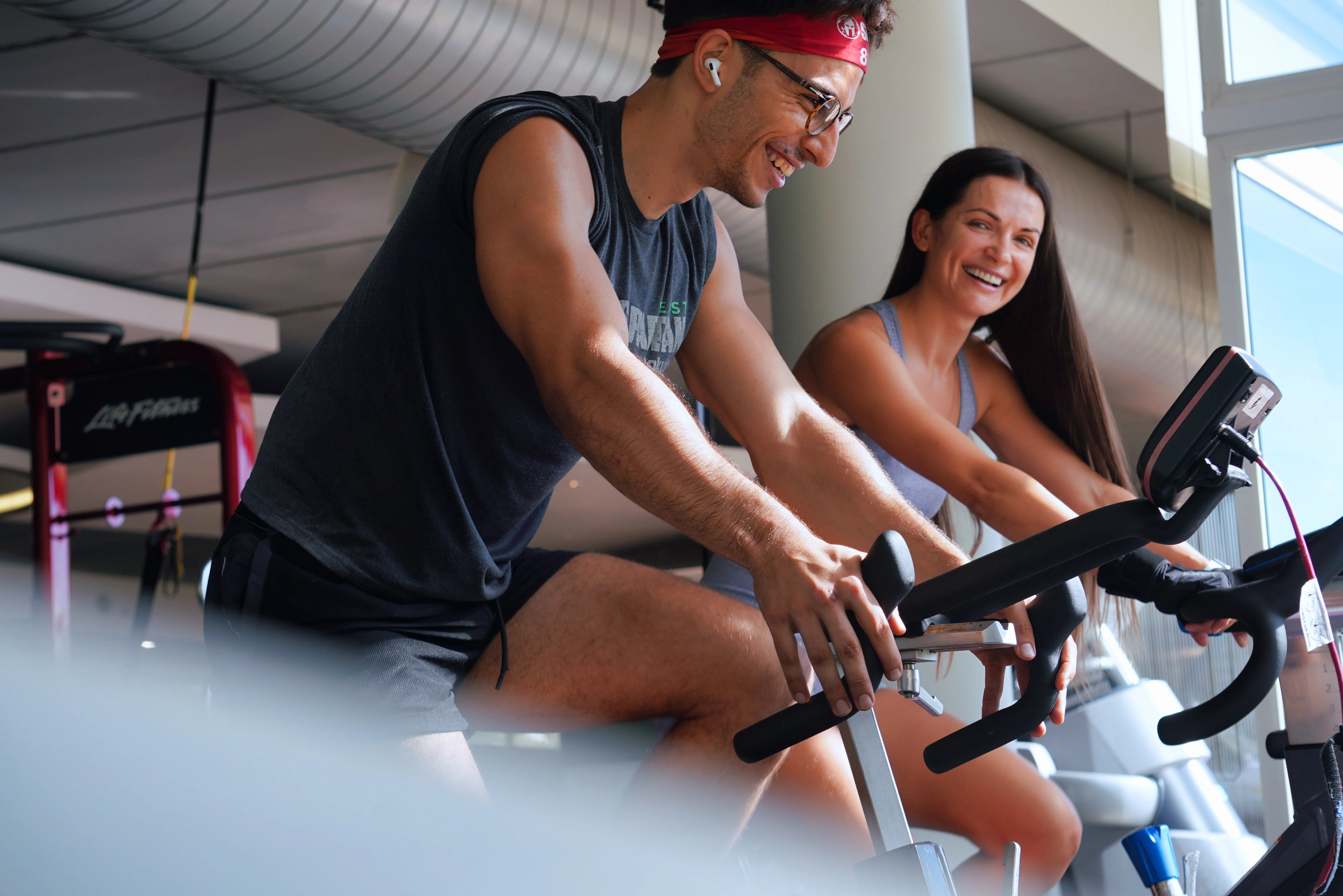 Two club members doing cycling exercise