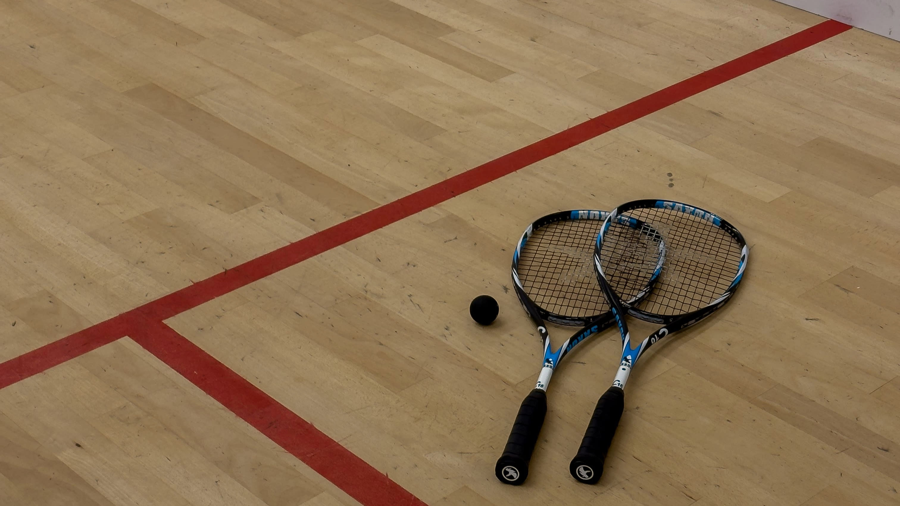 Two men on the indoor tennis courts