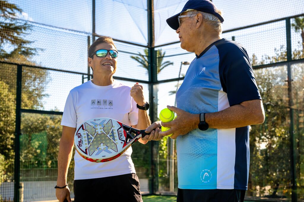 Two people playing a Padel match